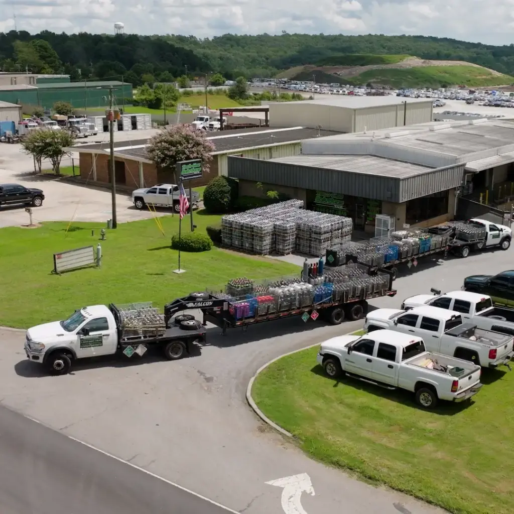 Tech Gas Solutions Gainesville GA facility with delivery trucks and cylinder trailers preparing for shipments across the Atlanta metro.