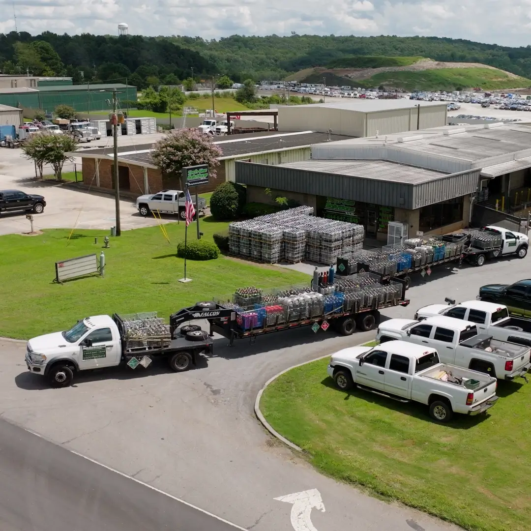 Tech Gas Solutions Gainesville GA facility with delivery trucks and cylinder trailers preparing for shipments across the Atlanta metro.